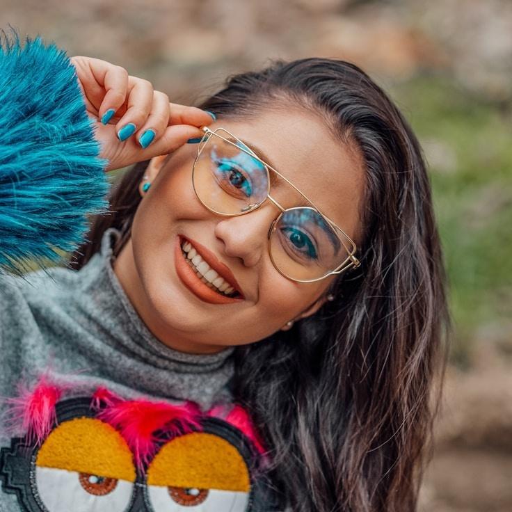 Kaveri Mehta, Lead Design Curator at SeedGroveCalm, reviewing corporate floral arrangements